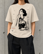 Application, Study 02 heavyweight boxy tee worn by a woman, front print of a monochrome portrait applying red lip pigment